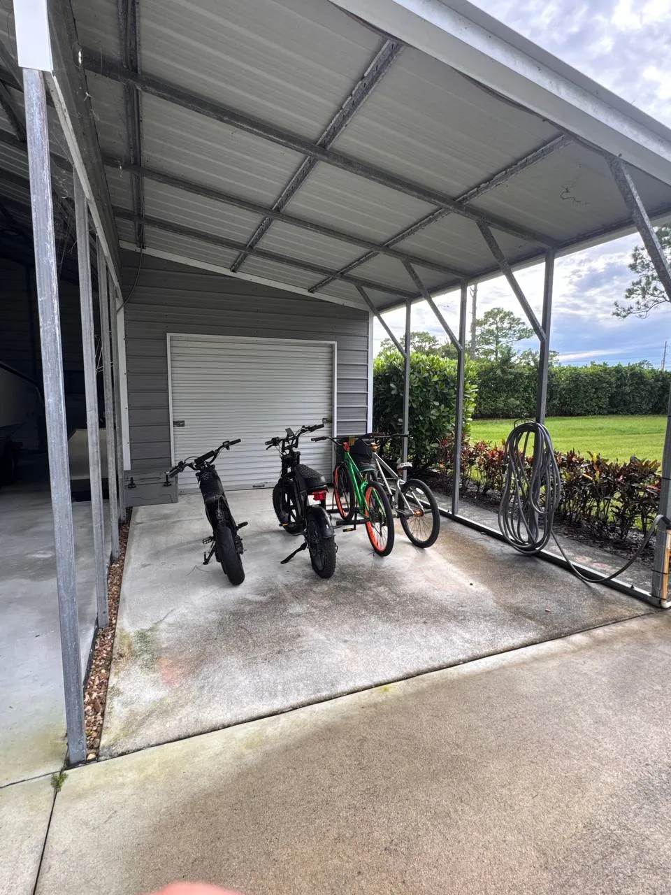 Carport concrete clean, before